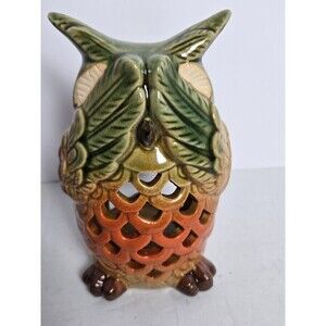 ceramic owl candle holder or lantern, featuring a multi-color glaze and pierced